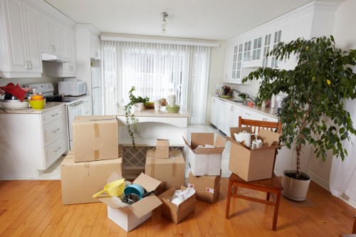 Professional packing team organising boxes in a Brent home
