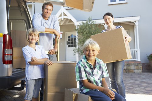 Packed boxes and furniture ready for a house move in Brent